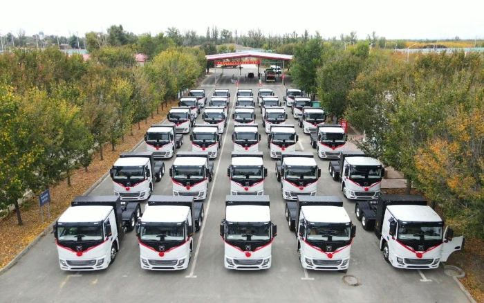 脱碳“换”绿进行时！esball官网电子游戏www.esball.com新能源重卡批量交付西北